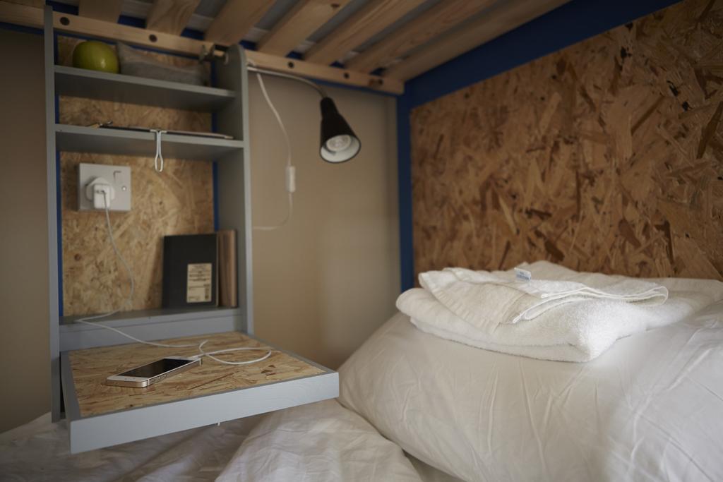 Cama en una habitación compartida mixta de 4 camas con baño compartido