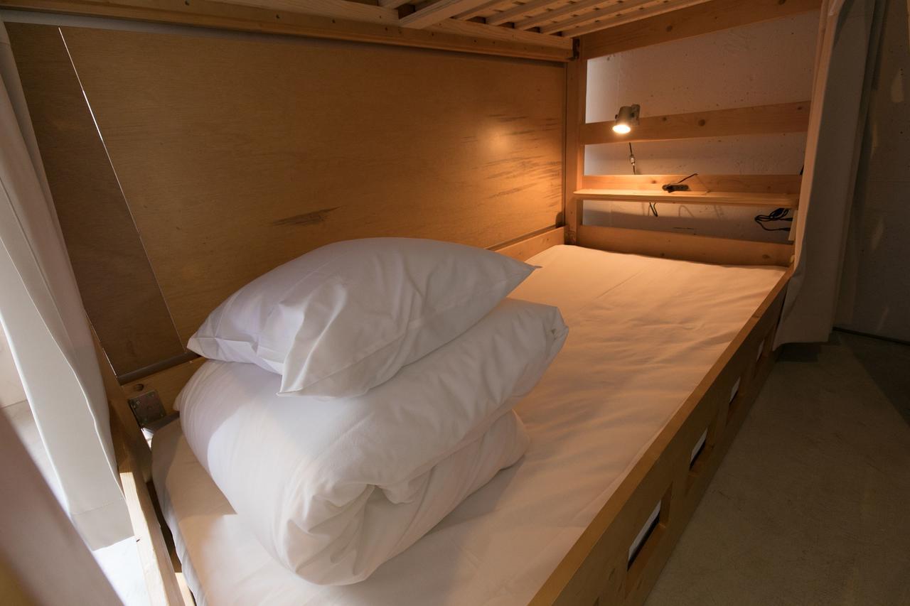 Cama individual en habitación compartida mixta