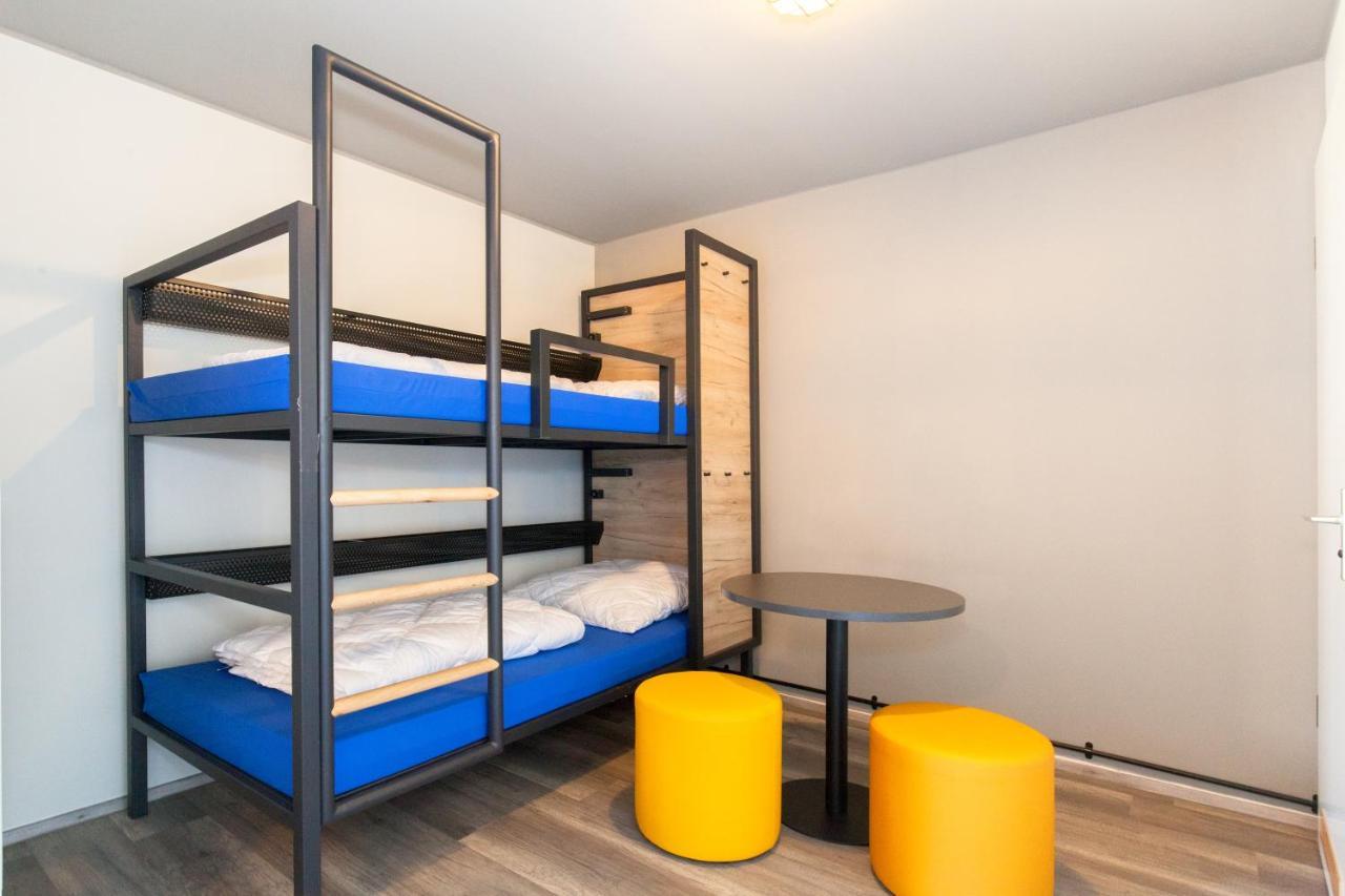 Cama en habitación compartida de 6 camas